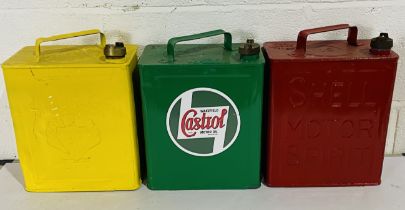 Three painted petrol cans including Shell, BP & Castrol