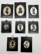 A collection of framed silhouettes including some by Eunice Green