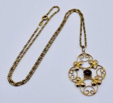 An Art Nouveau pendant set with a cabochon amethyst on 9ct gold chain, total weight 5.1g