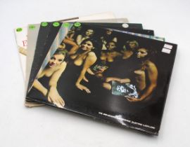 A collection of six 12" vinyl record albums by Jimi Hendrix, including 'Electric Ladyland', 'Band Of