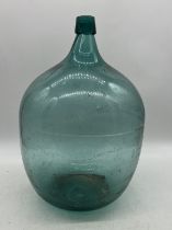 A large green glass carboy, height approx. 50cm