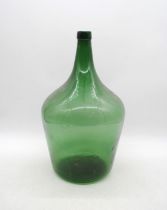 A green glass carboy - height 45cm