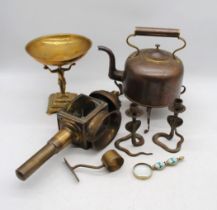 A copper kettle on stand, along with a brass tazza, pair of snake candlesticks etc.