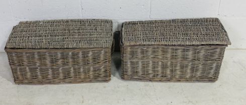 A pair of wicker baskets