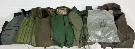 A collection of various men's outdoor and hunting coat and jackets including Barbour, Musto, Moutain