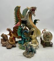 A collection of dragon figurines including the "Battle of the dragons" series - Glacier vs Snow, the