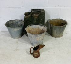 Three galvanised buckets, an Esso oil can and a petrol can