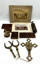 An assortment of vintage items including a brass crucifix, two brass oarlocks, a junior Pyrene