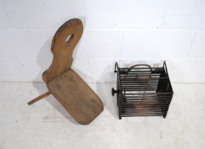 An early antique wooden chair with one leg, along with a metal folding fire escape ladder