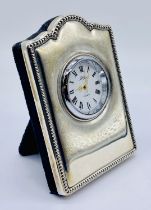 A small hallmarked silver clock, the dial signed R Carr, London