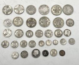 A collection of silver coinage including florins, half crowns, 1816 sixpence, Roman Denaris etc.