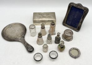 A collection of silver including cigarette box, photo frames, lidded pots etc.
