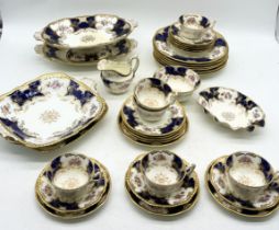 A Coalport part tea service mainly in the Batwing 2665 pattern tea service, c. 1900, comprising of