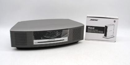 A Bose Wave Music System III, with a boxed Bose Wave Bluetooth Music Adapter