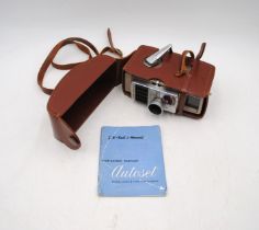 A Bell & Howell 624EE Autoset 8mm cine camera, in fitted leather case with instructions