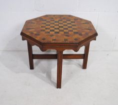 A wooden octagonal chess table - diameter 62cm, height 45.5cm