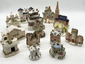 A collection of Staffordshire and Coalport pastille burners, cottages etc.