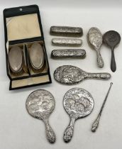 A collection of hallmarked silver dressing table items including mirrors, brushes etc.