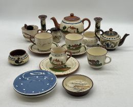 An assortment of Torquay ware including candlesticks, teapot, cups, saucers etc a couple of items