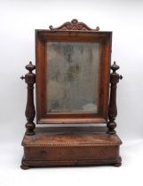 A Victorian mahogany dressing table mirror, with distressed glass and single drawer, with decorative