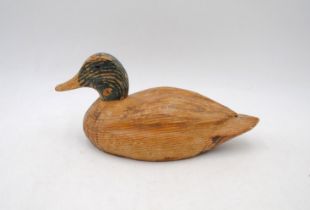 An antique carved wooden decoy duck - length 26cm