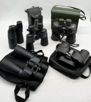 A collection of various binoculars including Panorama Commodore, Sunagor, Chinon Countryman,