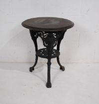 A small pub style table, with wooden top on cast iron base - diameter 58cm, height 70cm