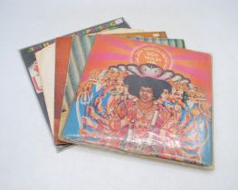A collection of five 12" vinyl record albums by Jimi Hendrix, including a first UK mono issue of '