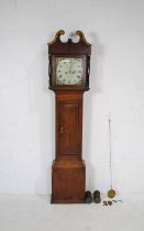 An antique oak longcase clock, with hand painted enamelled dial, name partially faded but originally