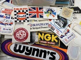 A large collection of vintage motoring and rally ephemera including stickers, car brochures