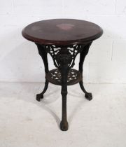 A small pub style table, with wooden top on cast iron base - diameter 59cm, height 70cm