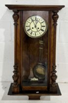 A turn of the century Vienna wall clock in walnut case, some damage but parts present