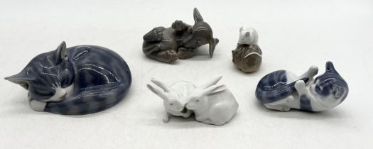 A collection of Royal Copenhagen including sleeping cat (422) ,pair of rabbits (518), puppy (4108)