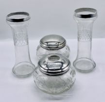 Two silver lidded dressing table pots along with a pair of silver mounted vases