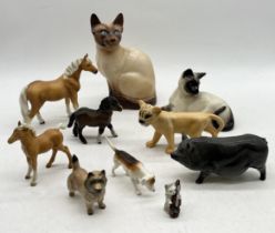 A collection of mainly Beswick animals including lion cub, Siamese cat, Shetland pony foal, Carin