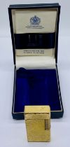 A vintage Dunhill 70 gold-plated cigarette lighter in original box with instructions