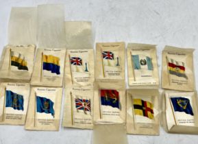 A collection of Kensitas silk cigarette cards depicting flowers and flags (forty eight in total)