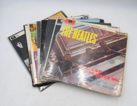 A collection of nine 12" vinyl record albums by The Beatles and related, including 'Please Please