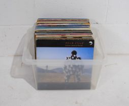 A quantity of various 12" vinyl records, including The Rolling Stones, Pink Floyd, David Bowie,
