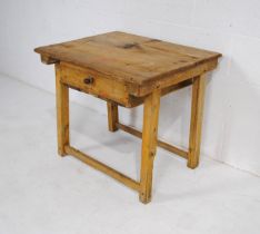 An antique rustic pine child's desk, with single drawer - length 70cm, depth 58cm, height 60.5cm