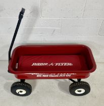 A "Radio Flyer Big Red Classic ATW" pull along trolley
