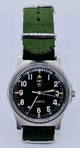 A CWC British military wristwatch with black enamelled dial and white Arabic numerals. Broad Arrow