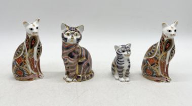 Four unboxed Royal Crown Derby paperweights in the form of cats including an Imari Siamese cat and