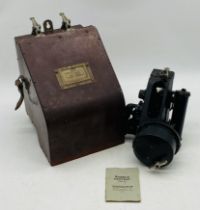 A vintage bubble sextant (Mark IXA), stored in wall hanging Bakelite case