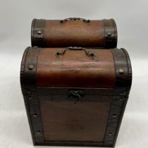 A pair of dome topped wooden wine carriers