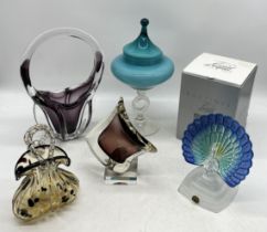 A small collection of art glass including frosted peacock