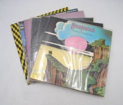 A collection of six 12" vinyl record albums by Hawkwind, including 'Warrior On The Edge Of Time', '