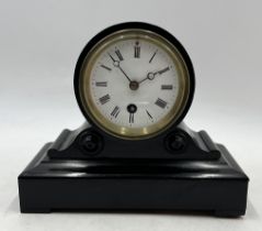 A small ebonised drum head mantle clock by W.F. Wiltshire