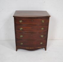 A Georgian inlaid mahogany bow-fronted chest of four drawers of small proportions, with brass