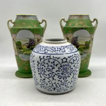 A pair of Noritake vases, repaired crack to one handle along with a ginger jar.